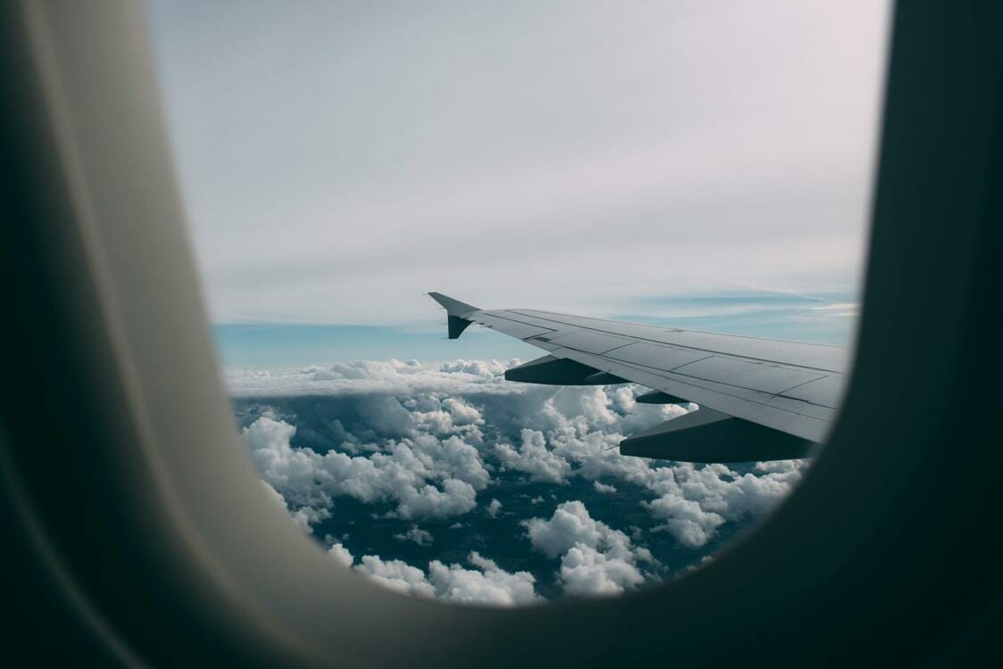 rubber-extrusion-process-glazing View of airplane wing and top of clouds from window seat | Rubber extrusion process | Window glazing